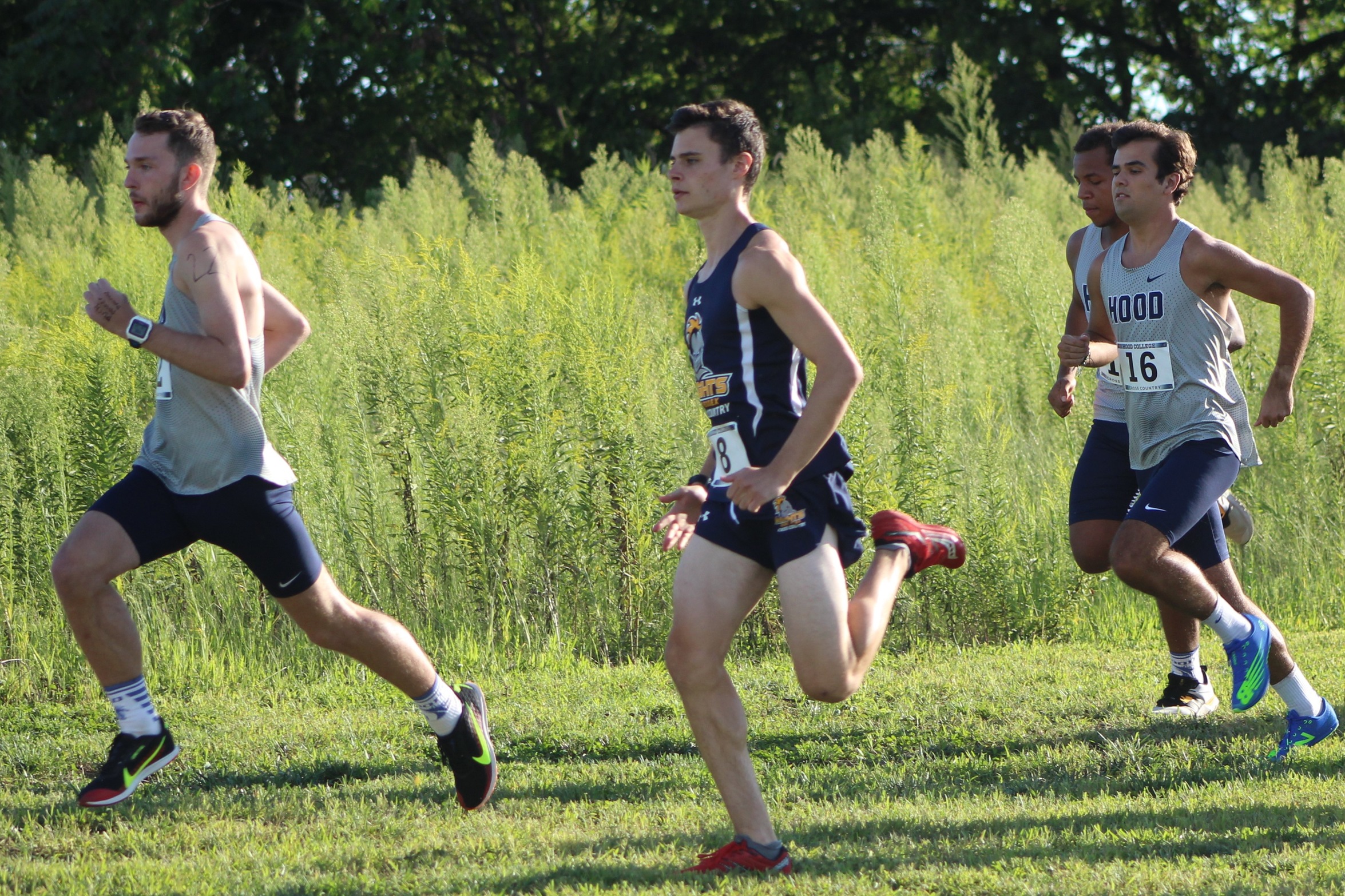 Braden Berkey (center) paces with the front of the pack at the Blazer Twilight Invitational. Photo courtesy of Hood Athletics